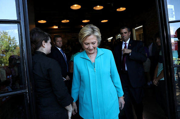 RENO, NV - AUGUST 25: Democratic presidential nominee former Secretary of State Hillary Clinton leaves Hub Coffee Roasters on August 25, 2016 in Reno, Nevada. Hillary Clinton delivered a speech about republican presidential nominee Donald Trump's policies. (Photo by Justin Sullivan/Getty Images)