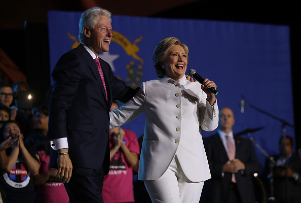 NORTH LAS VEGAS, NV - OCTOBER 19: Democratic presidential nominee Hillary Clinton (L) and her husband former U.S. President Bill Clinton speak during a debate watch party at Craig Ranch Regional Amphitheater following the third U.S. presidential debate at UNLV on October 19, 2016 in North Las Vegas, Nevada. Tonight was the final debate ahead of Election Day on November 8. (Photo by Justin Sullivan/Getty Images)